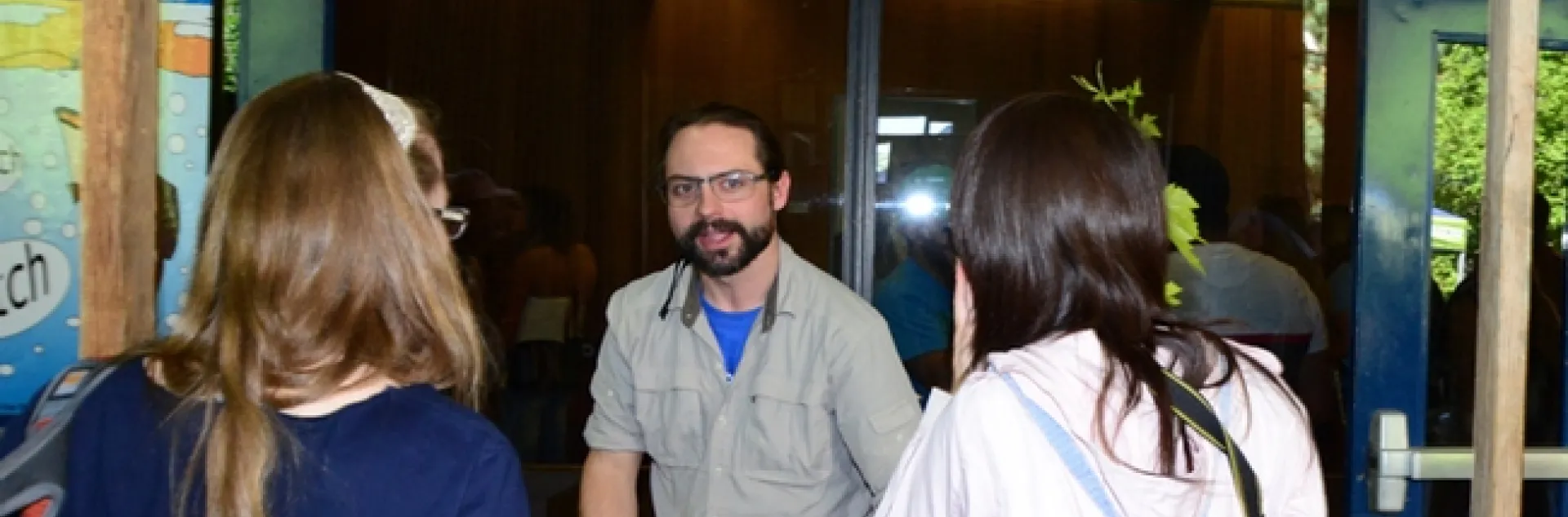 Doctoral candidate Brendon Boudinot answers questions about insects in the Bug Doctor booth at Briggs Hall. (Photo by Kathy Keatley Garvey)