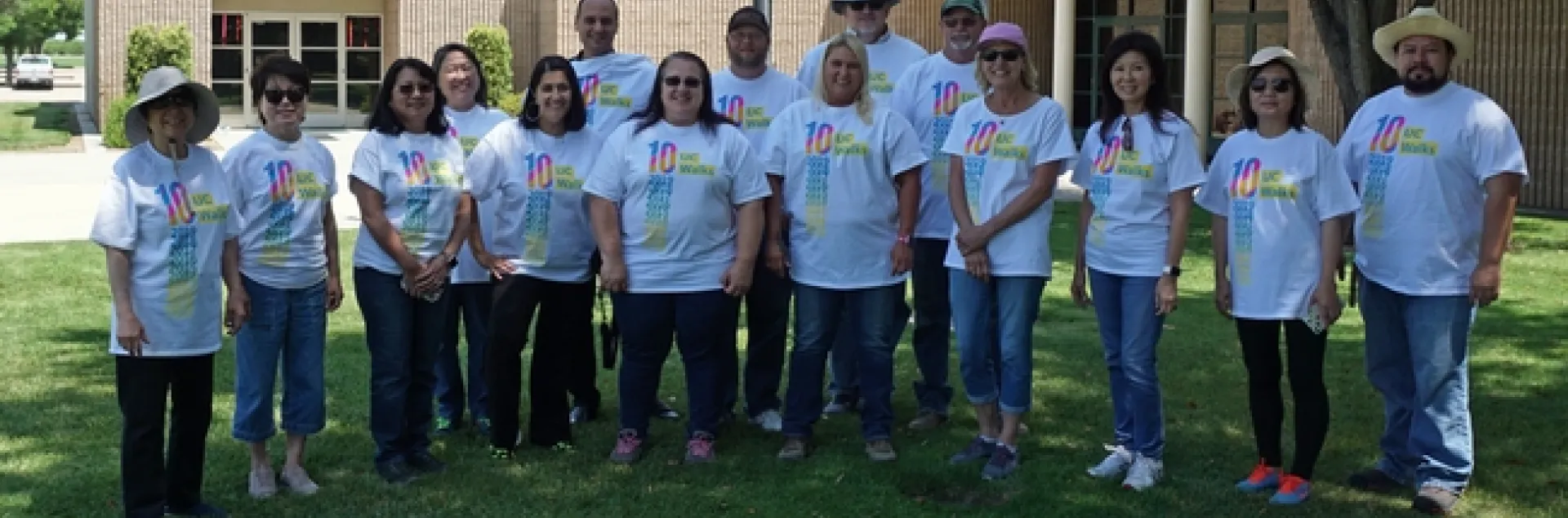 The Kearney walking team poses for a picture before setting out for a lunchtime walk on the center grounds.