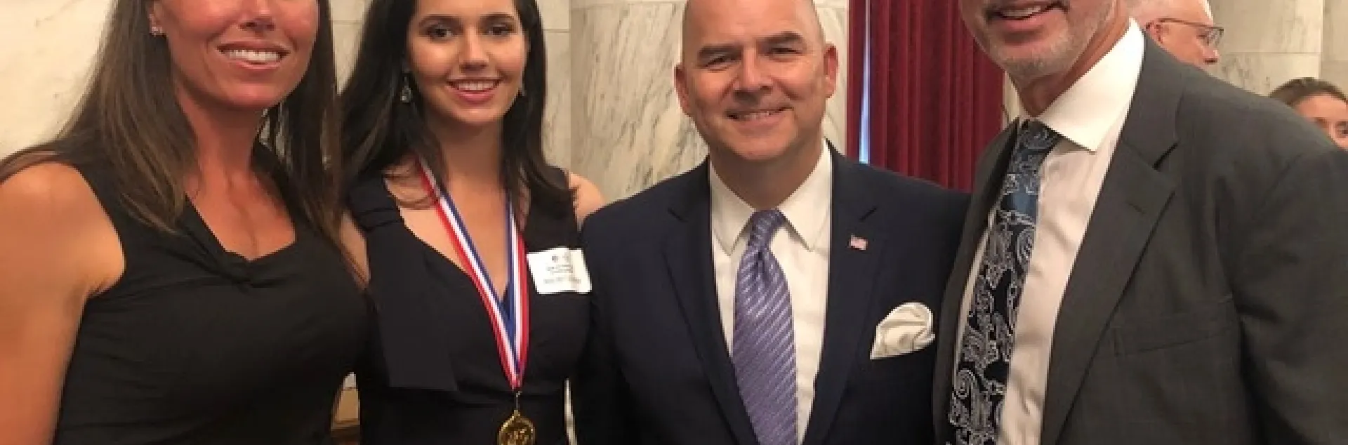 Elizabeth Sugarman, Sissy Sugarman, Ray Kerins of Bayer Corporation, and Shawn Sugarman at the Congressional Gold Medal award ceremony