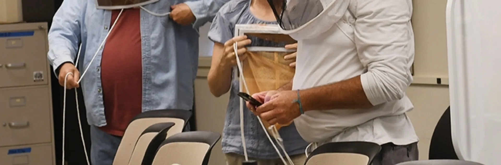Participants in the "Planning Ahead for Your First Hives" don protective veils. (Photo by Kathy Keatley Garvey)