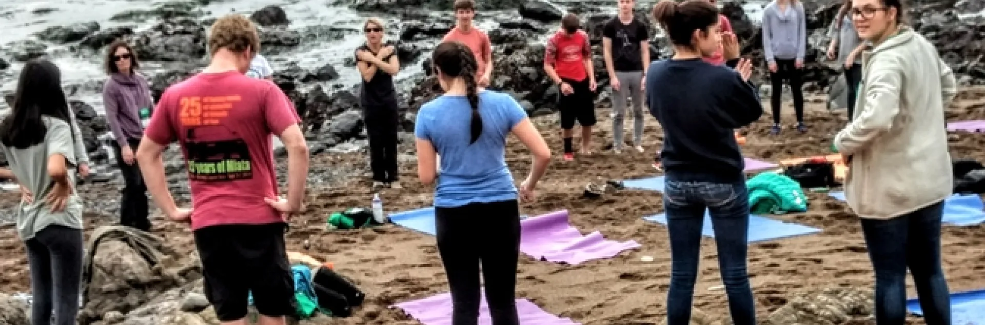 Group yoga on the beach