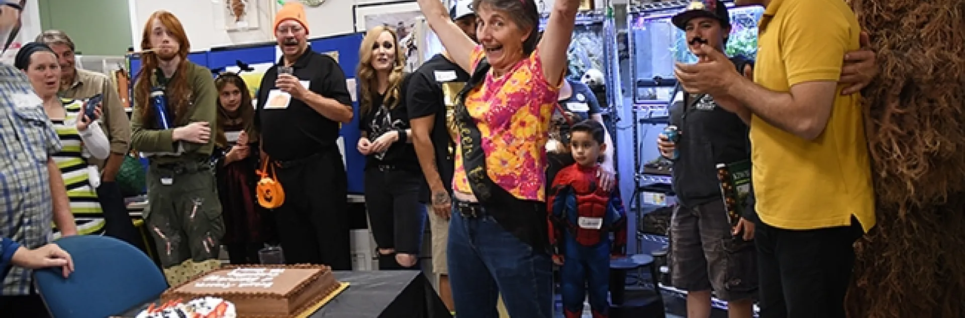 Lynn Kimsey, director of the Bohart Museum of Entomology, welcomes the crowd to the Halloween party. (Photo by Kathy Keatley Garvey)