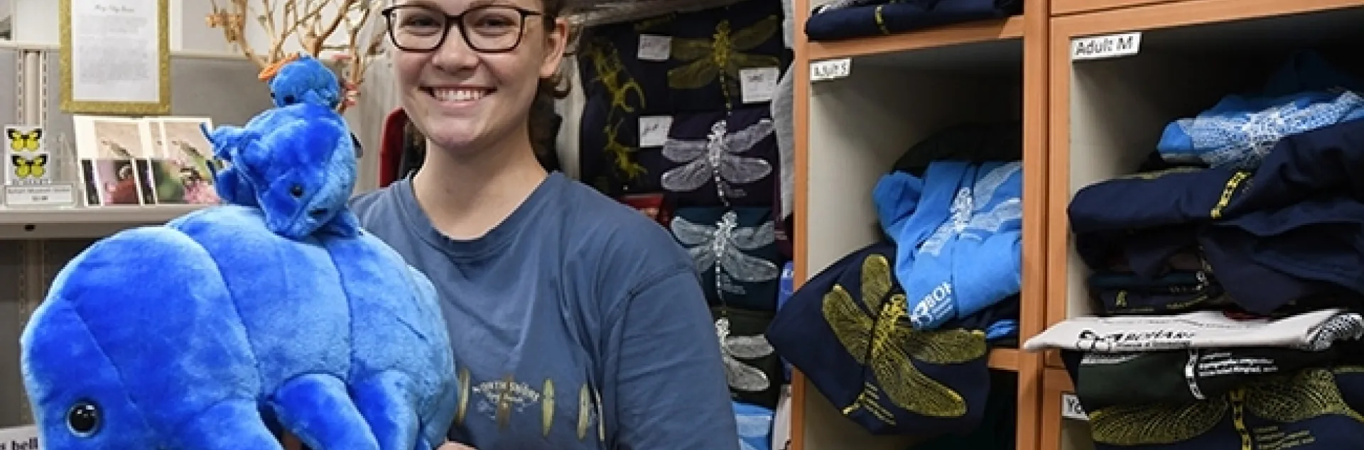 Eliza Litsey, UC Davis entomology alumnus, holds a selection of water bears (tardigrades) in the Bohart Museum of Entomology gift shop. (Photo by Kathy Keatley Garvey)