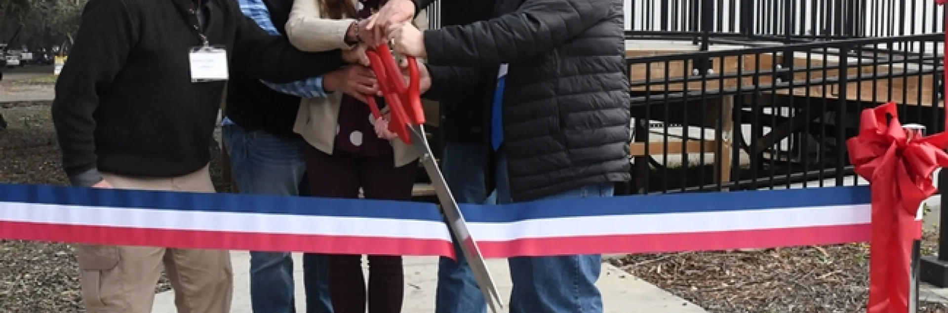 Ready to cut the ribbon (from left) are almond pollination consultant Robert Curtis of Carmichael, retired director of agricultural affairs, Almond Board of California; Brad Pankratz of Can-Am Apiaries, Orland; Jackie Parks-Burris of Jackie Park-Burris Queen Bees, Palo Cedro and a past president of California State Beekeepers' Association; Darren Cox, Logan, Utah, past president of American Honey Producers; and Kelvin Adee of Bruce, S.D., president of American Honey Producers.