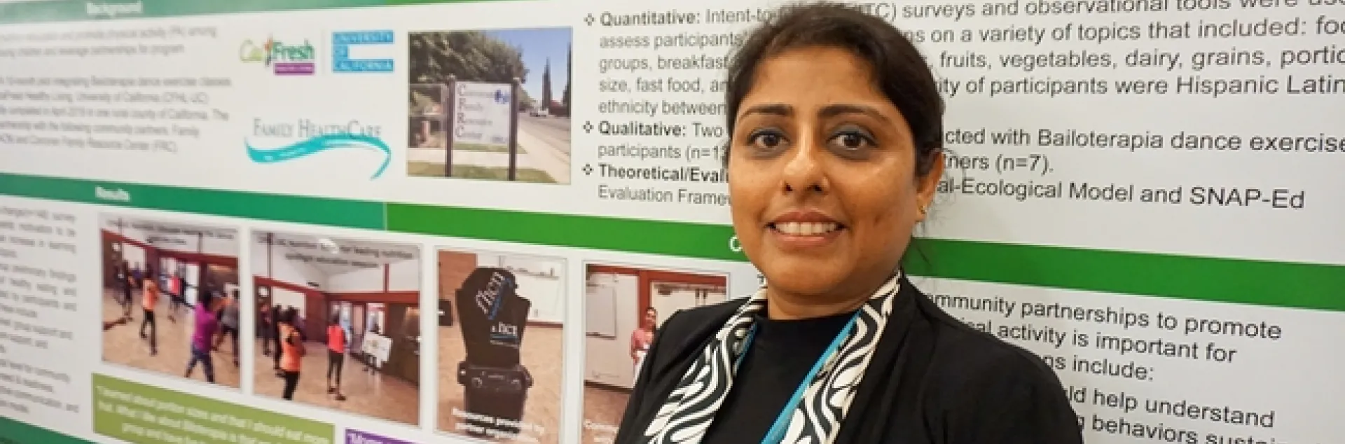 UCCE nutrition, family and consumer sciences advisor Deepa Srivastava in front of one of the posters she presented at the California Childhood Obesity Conference.