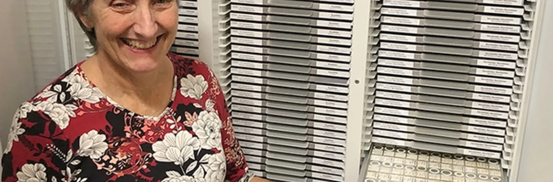 Lynn Kimsey, director of the Bohart Museum of Entomology, with part of the tardigrade collection. The Bohart collection includes some 25,000 slide-mounted specimens. (Photo by Kathy Keatley Garvey)