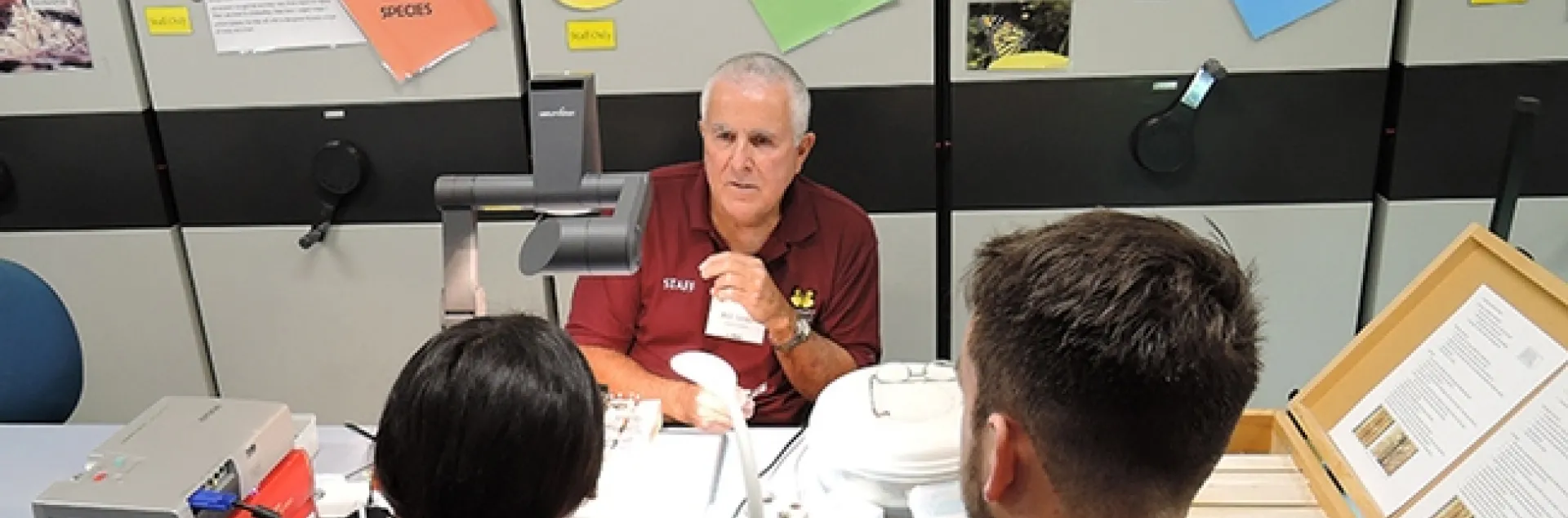 Entomologist Jeff Smith, curator of the Bohart Museum of Entomology's Lepidoptera collection, discusses how to pin and spread specimens. (Photo by Kathy Keatley Garvey)