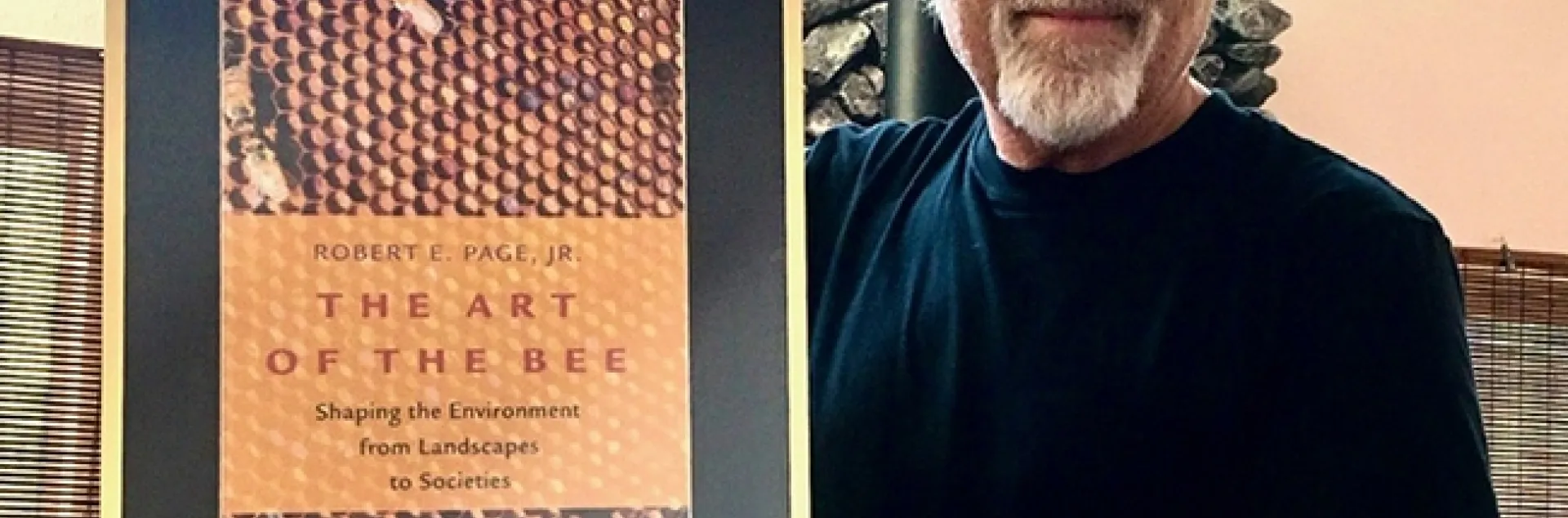 Honey bee geneticist and biologist Robert E. Page Jr. with his book,"The Art of the Bee."