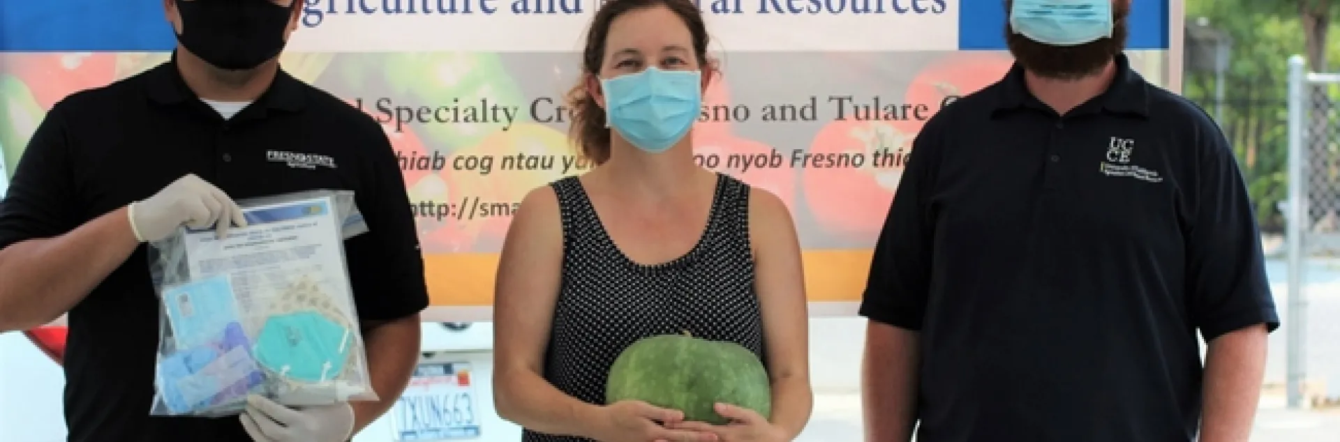 From left, UCCE small-farm team members Jesus Ontiveros Barajas, Marianna Castiaux and Jacob Roberson distributed COVID-19 safety kits to small-scale farmers in Fresno County. Photo by Carmen Mendoza