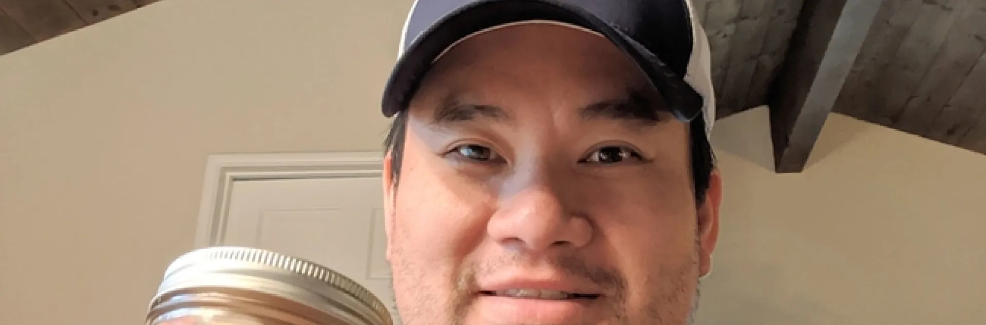 Kit Leung showing vegetables he grew and pickled Vietnamese style.