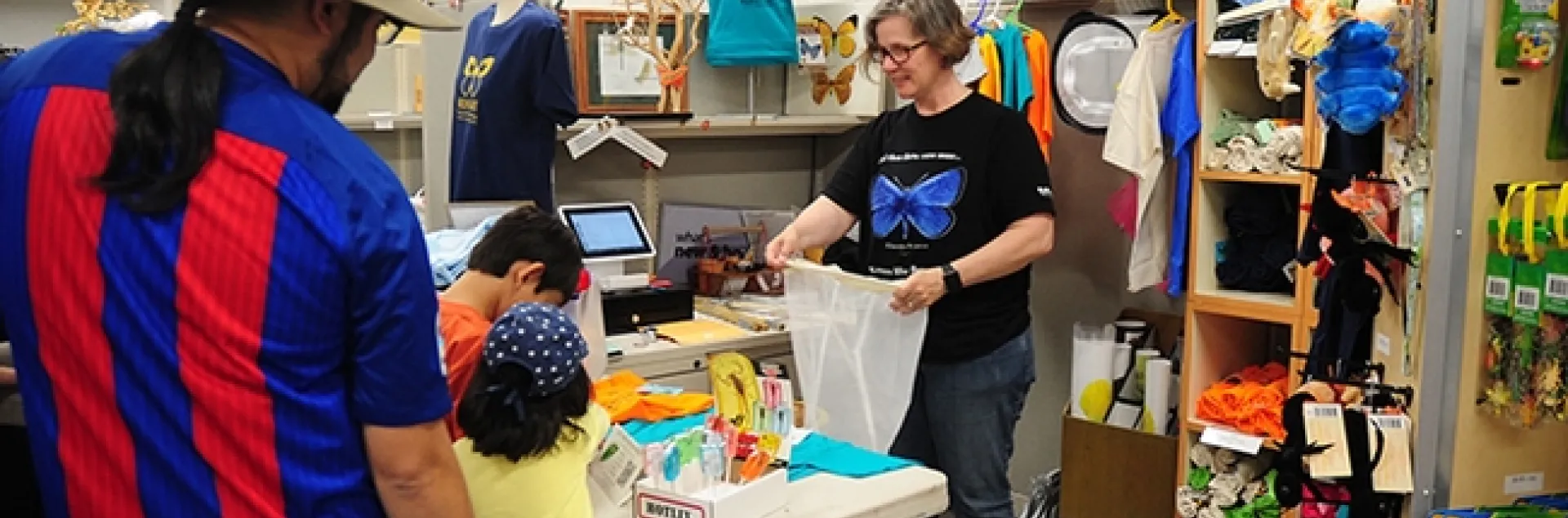 Bohart Museum associate Fran Keller, a professor at Folsom Lake College who holds a doctorate in entomology from UC Davis, helps customers at the Bohart gift shop in this pre-COVID-19 image. (Photo by Kathy Keatley Garvey)