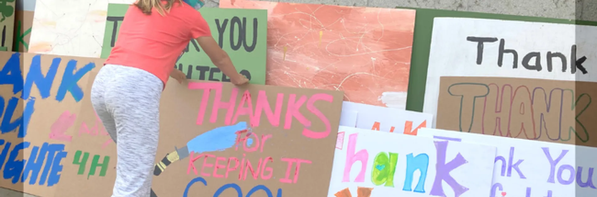 Girl with Thank You Signs