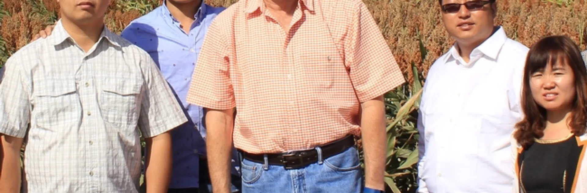 Jeff Dahlberg, center, with a delegation of Chinese sorghum scientists on Sept. 24, 2015, in a sorghum field at Kearney.