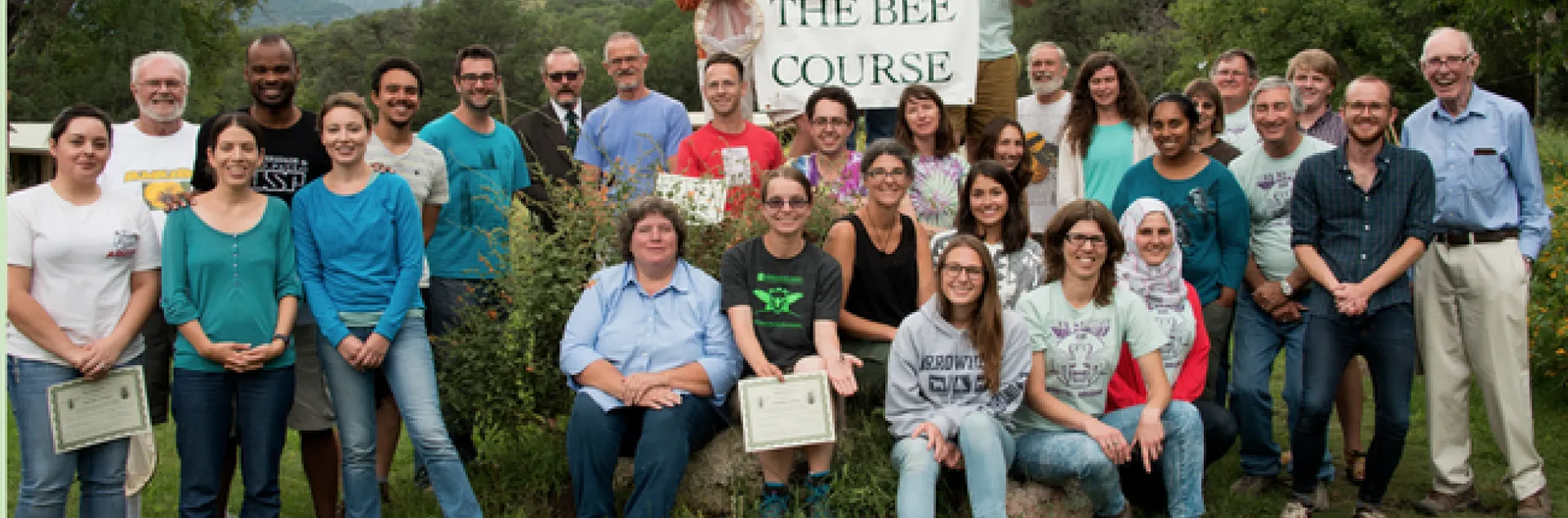 In this 2015 Bee Course class photo, Charlie Nicholson (top, far left) holds the sign. In the second row, far left, is co-instructor Robbin Thorp, UC Davis distinguished emeritus professor of entomology. Nicholson is the winner of the inaugural Robbin Thorp Memorial First-Bumble-Bee-of-the-Year Contest, sponsored by the Bohart Museum of Entomology. (Photo courtesy of The Bee Course)