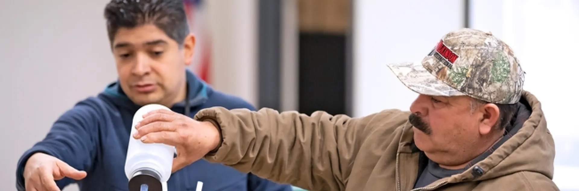 In 2019, ANR offered more than 40,000 educational events across California on topics such as drought, climate change and invasive species. UCCE specialist Sam Sandoval, left, gave soil and water management training for field workers in Spanish in 2019. Photo by Evett Kilmartin