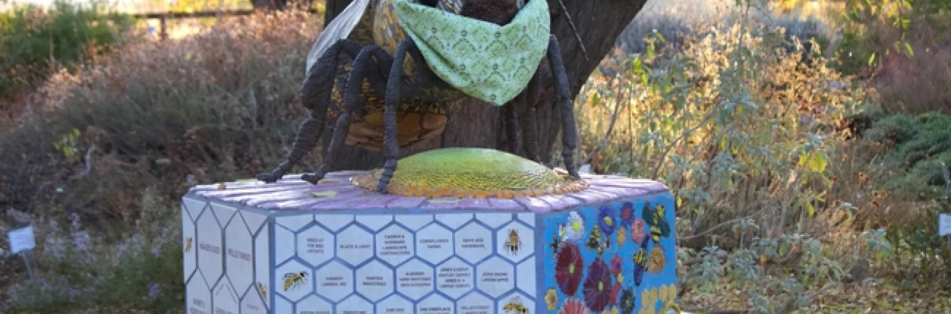 Bee statue at the Haven wearing a mask