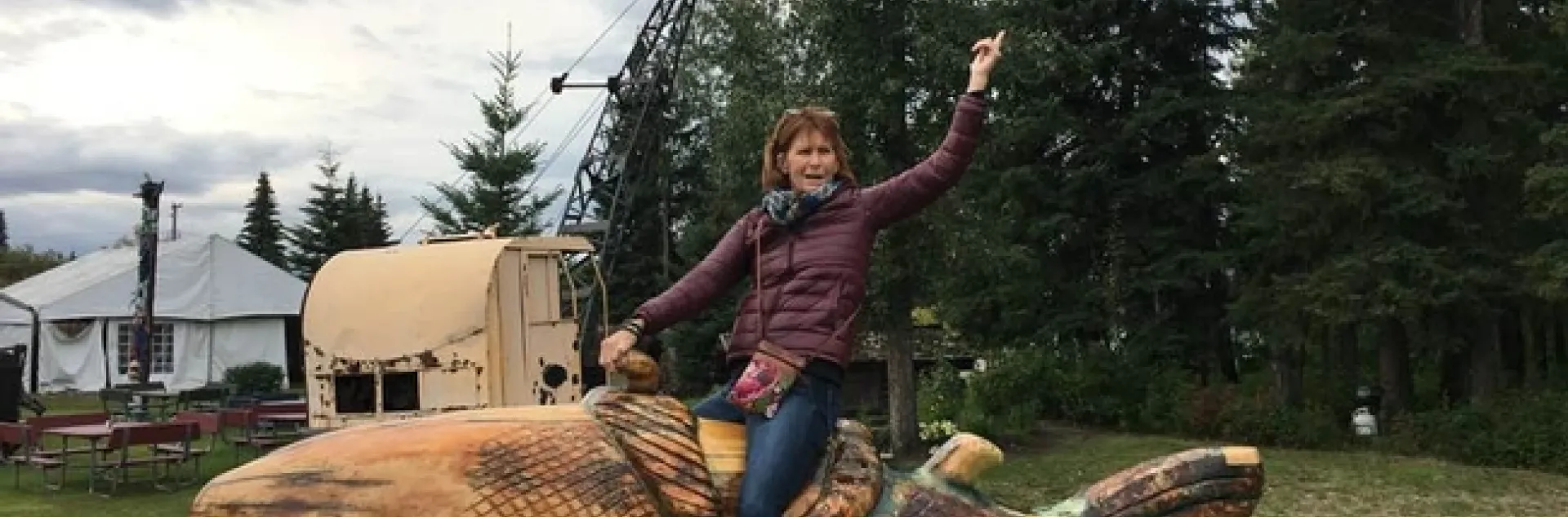 Debra Driskill, shown riding high in Alaska, retired from UC ANR in January.