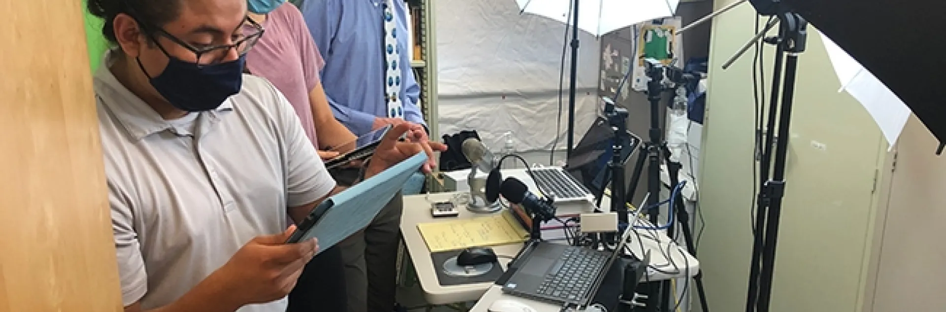 UC Davis distinguished professor Walter Leal (far right) preparing for the chat session of the international symposium on olfaction and taste. Assisting him are students Efrain Vasquez (foreground) and Kelly Brandt.