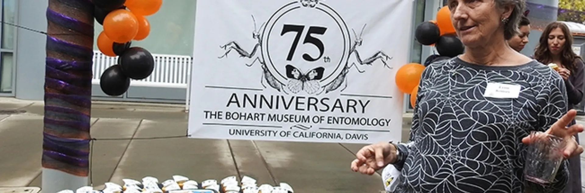 Lynn Kimsey, director of the Bohart Museum of Entomology, talks to the crowd before cutting the cake. (Photo by Kathy Keatley Garvey)