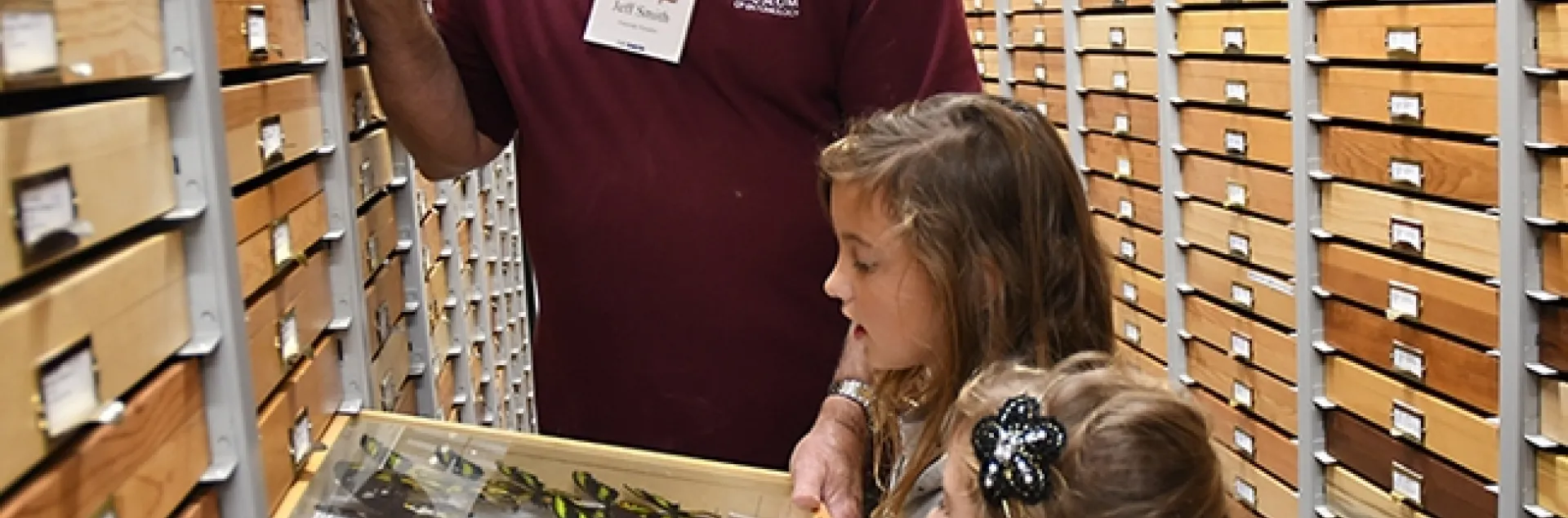 Jeff Smith, curator of the Lepidoptera collection at the Bohart Museum of Entomology, shows visitors some of the butterfly specimens. The worldwide Lepidoptera collection now totals more than 500,000. One of the most recent donors was the late Charles Hageman of Yuba City (1945-2021). (Photo by Kathy Keatley Garvey)
