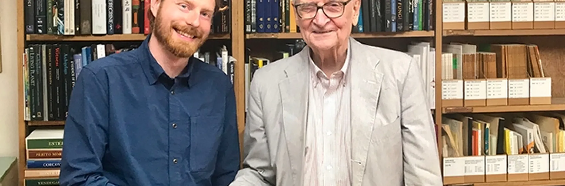Marek Borowiec (left) shakes hands with E. O. Wilson at the Harvard Museum of Comparative Zoology (MCZ). Borowiec went on to receive his doctorate in entomology from UC Davis and is now an assistant professor at the University of Idaho.