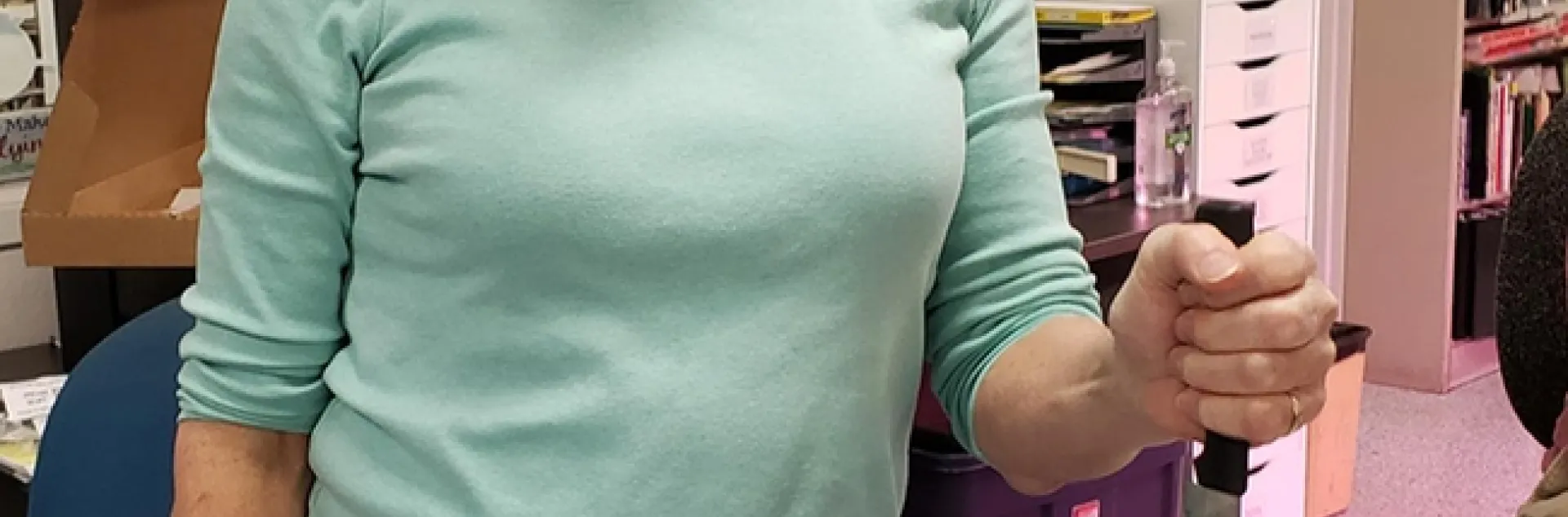 Lynn Kimsey, director of the Bohart Museum of Entomology, prepares to cut her birthday cake. (Photo by Tabatha Yang)