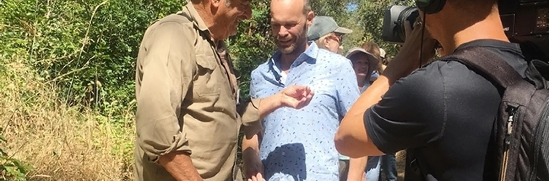 Greg Karefelas (left), an associate at the Bohart Museum of Entomology, shares his expertise of the California dogface butterfly with Rob Stewart of the TV program, "Rob on the Road."