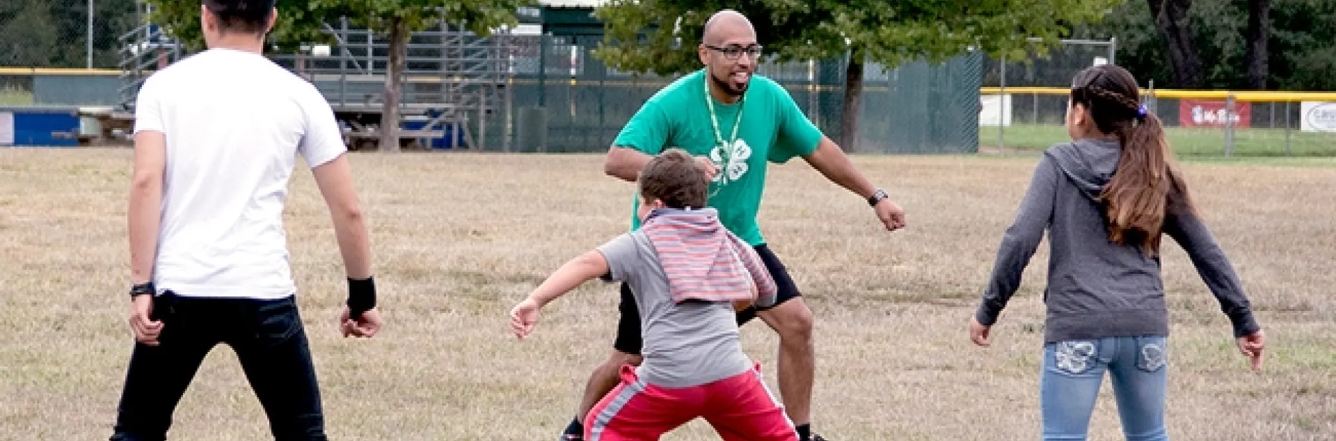 4-H summer camp participants exercise.