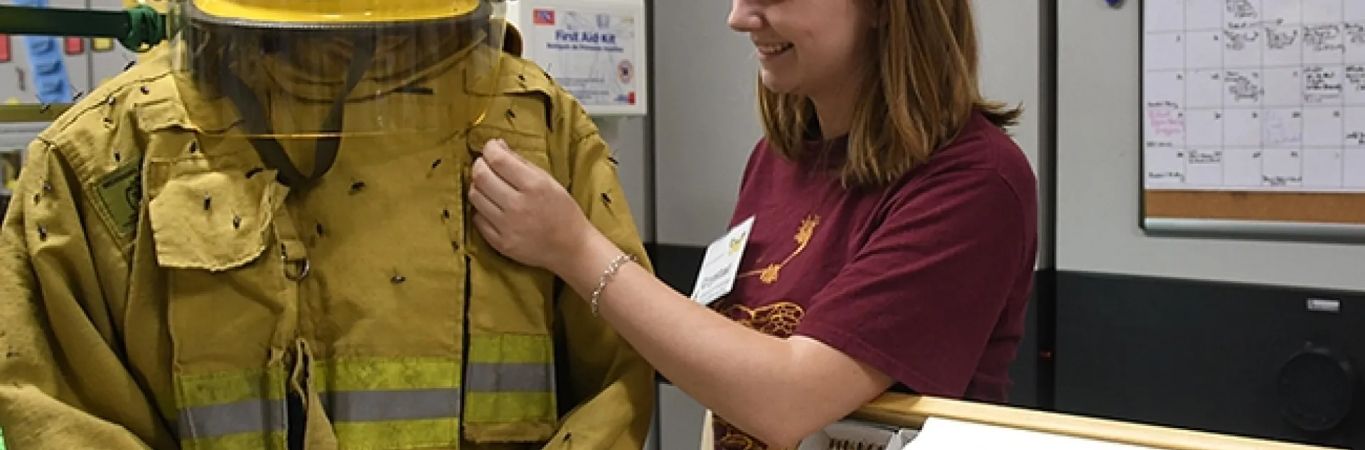 UC Davis forest entomologist and doctoral student Crystal Homicz assists a fire beetle demonstration at a 2018 Bohart Museum of Entomology open house. The fire beetles are in the genus Melanophila and are sensitive to smoke and heat from smoldering trees after a fire. (Photo by Kathy Keatley Garvey)