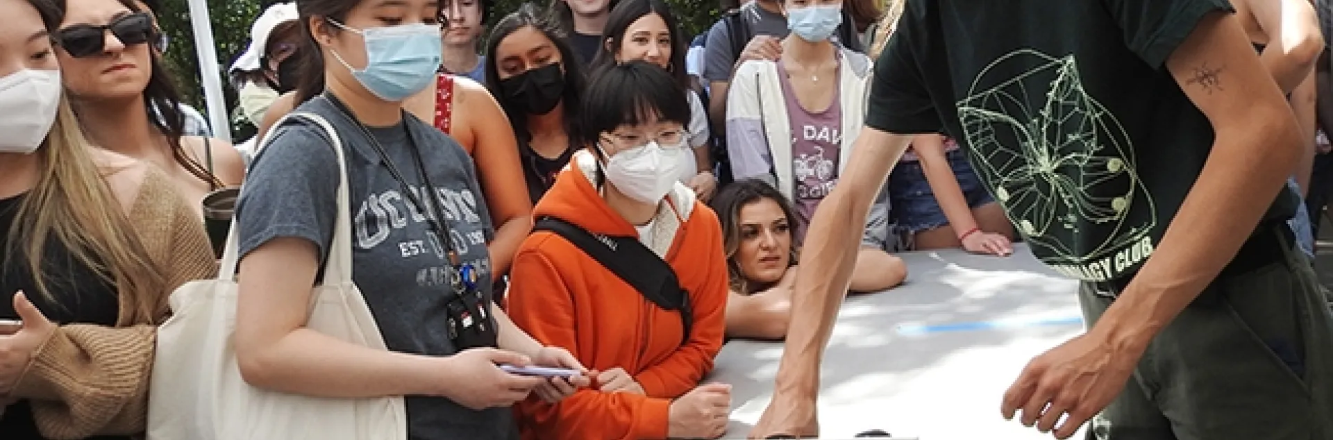 Kyle Elshoff of the UC Davis Entomology Club retrieves a winning roach. (Photo by Kathy Keatley Garvey)