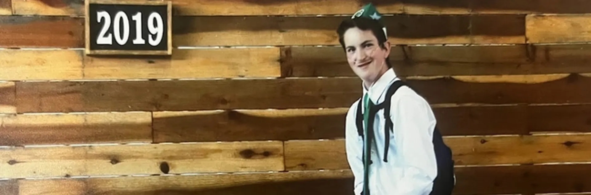 Author with first place ribbon on goat in front of Napa Town & Country Fair 2019 sign