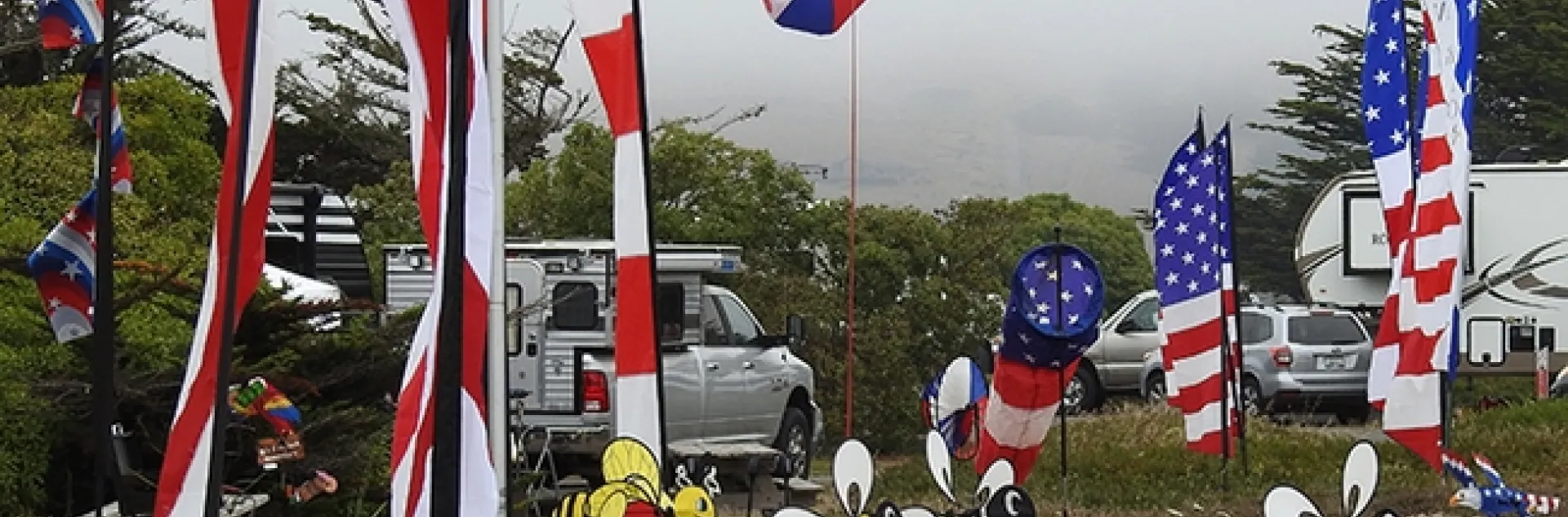 Hurrah for the red, white and blue! And the yellow. Honey bee mobiles were spinning in the wind at a Bodega Bay campsite. (Photo by Kathy Keatley Garvey)