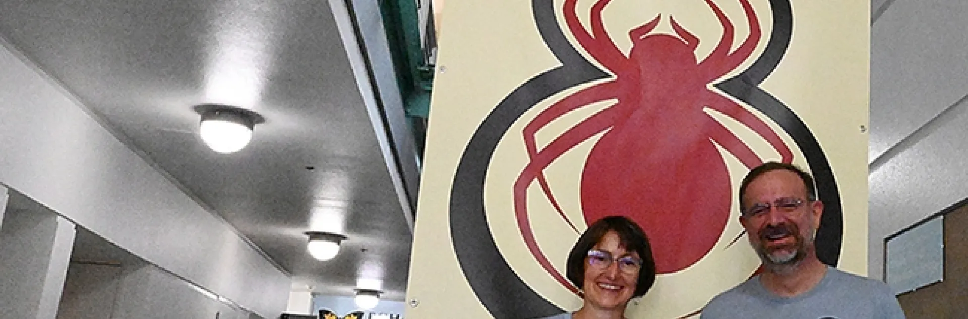 Associate Dean Jason Bond of UC Davis and Professor Eileen Hebets of the University of Nebraska, Lincoln, at the "Eight Legged Encounters" open house, hosted by the Bohart Museum of Entomology and the American Arachnological Society. (Photo by Kathy Keatley Garvey)