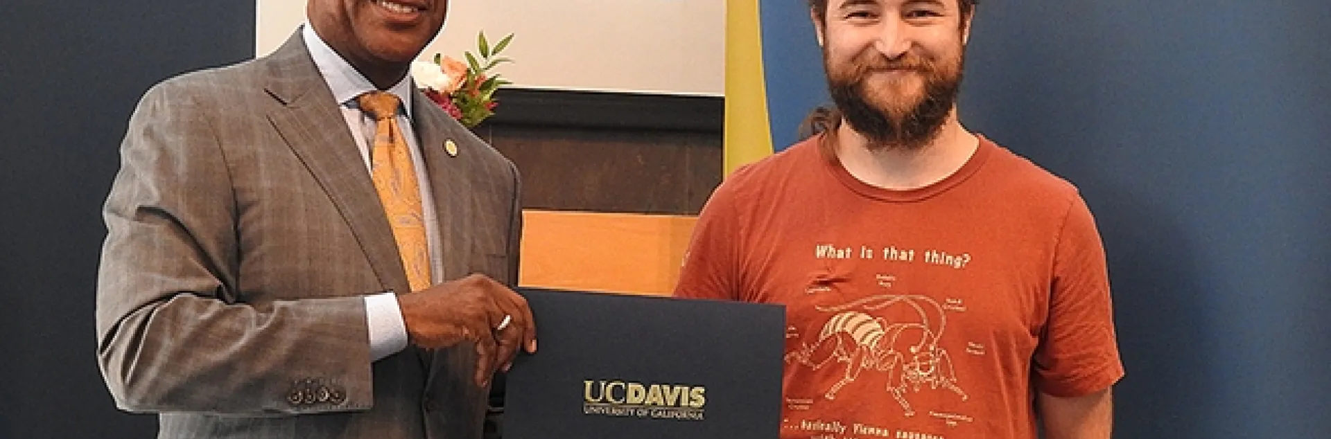 UC Davis entomologist Brennen Dyer, a lab assistant at the Bohart Museum of Entomology, with UC Davis Chancellor Gary May. (Photo by Kathy Keatley Garvey)