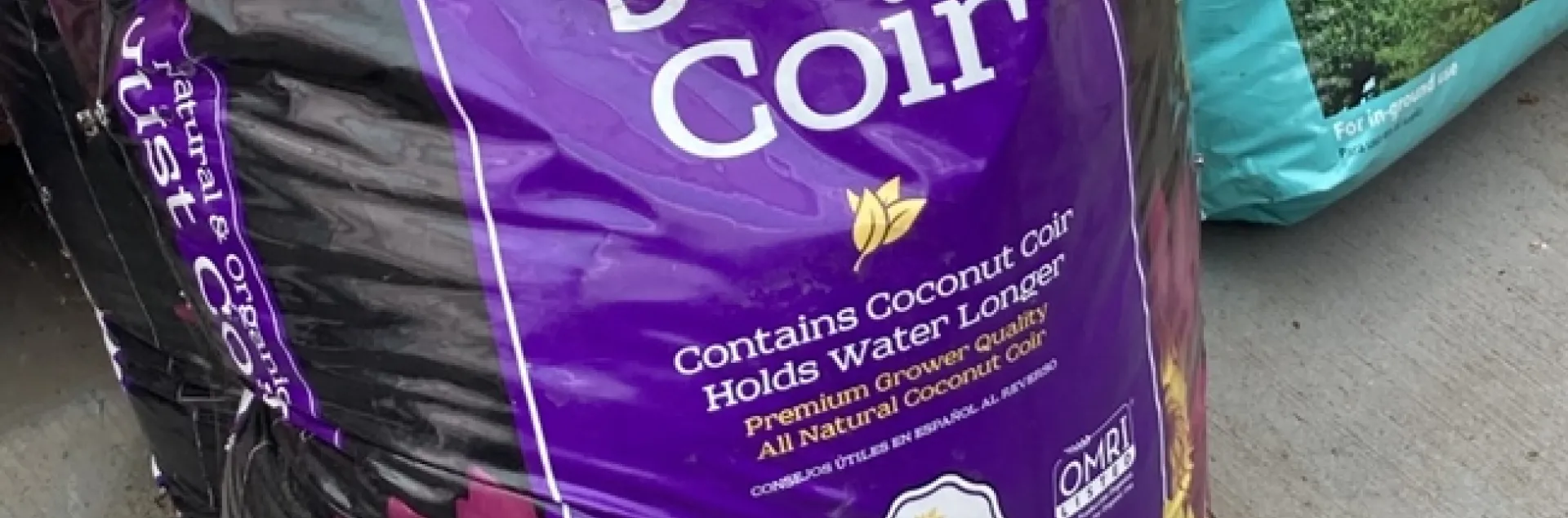 black and purple plastic bag of coir