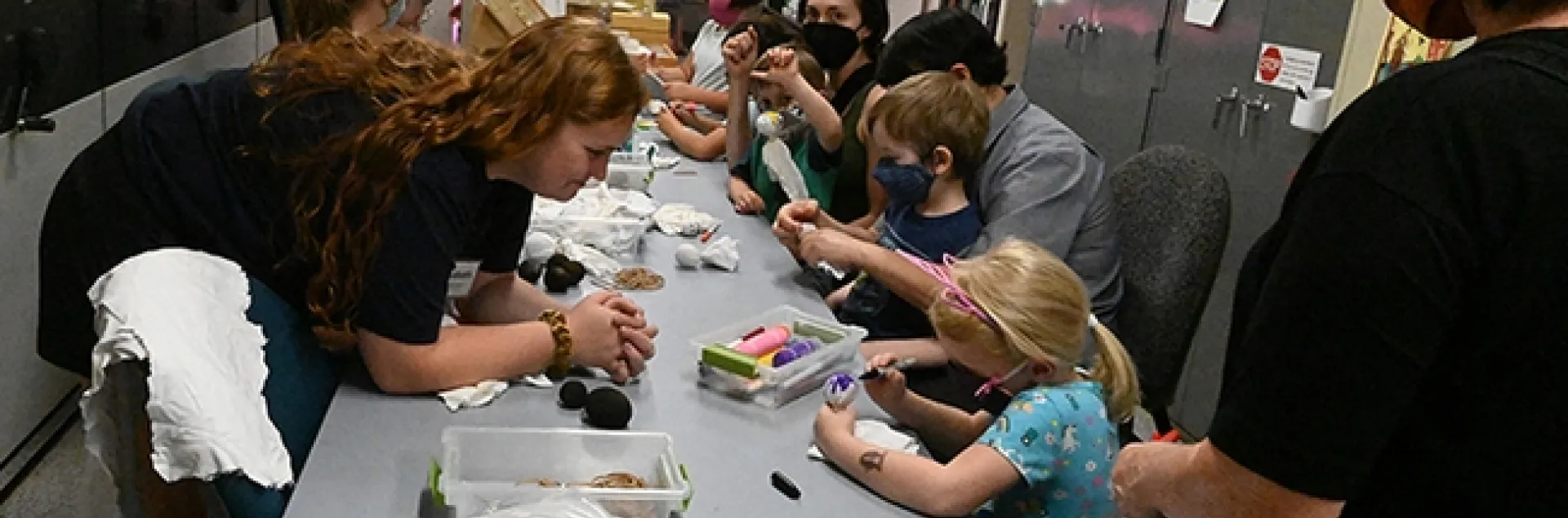 The Bohart Museum's family arts-and-crafts table, featuring how to make gall ghosts, was busy throughout the open house, themed "Weird and Wonderful Wasps." (Photo by Kathy Keatley Garvey)