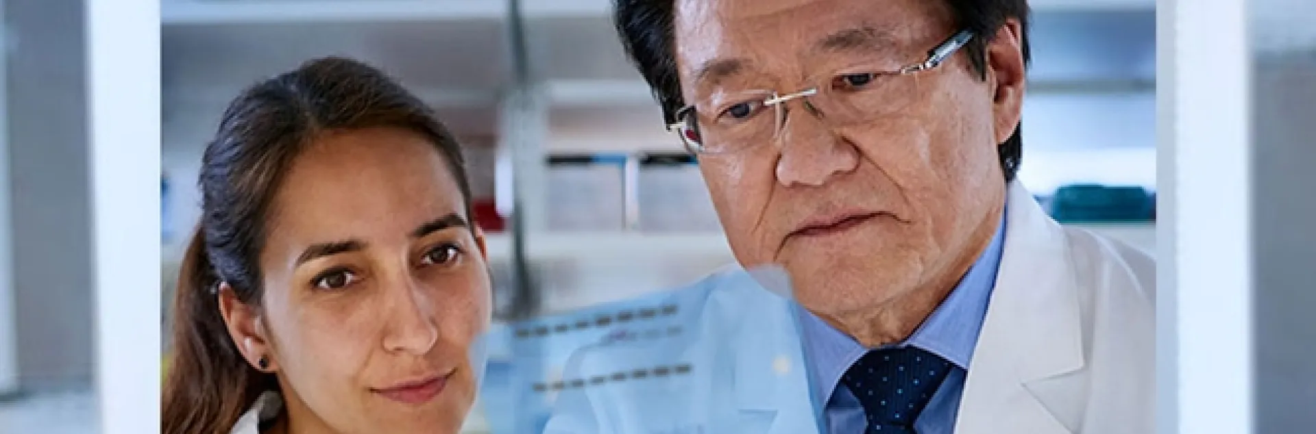 Filipa Rijo-Ferreira (left) won the Brown-Goldstein Award for Excellence in Postdoctoral Research in 2021 for her work investigating the circadian clocks of human parasites. This is the highest honor bestowed by the University of Texas Southwestern Graduate School of Biomedical Sciences. Here she looks over data with world-renowned circadian rhythm researcher Joseph Takahashi. (Photo courtesy of the University of Texas Southwestern Medical Center, Dallas)
