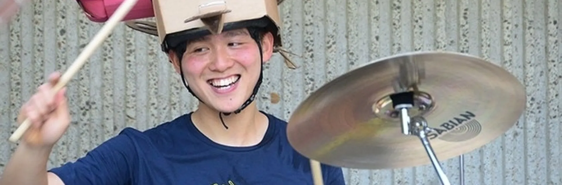 Yao Cai dressed as a fruit fly to play the drums in The Entomology Band at the 2018 UC Davis Picnic Day. (Photo by Kathy Keatley Garvey)