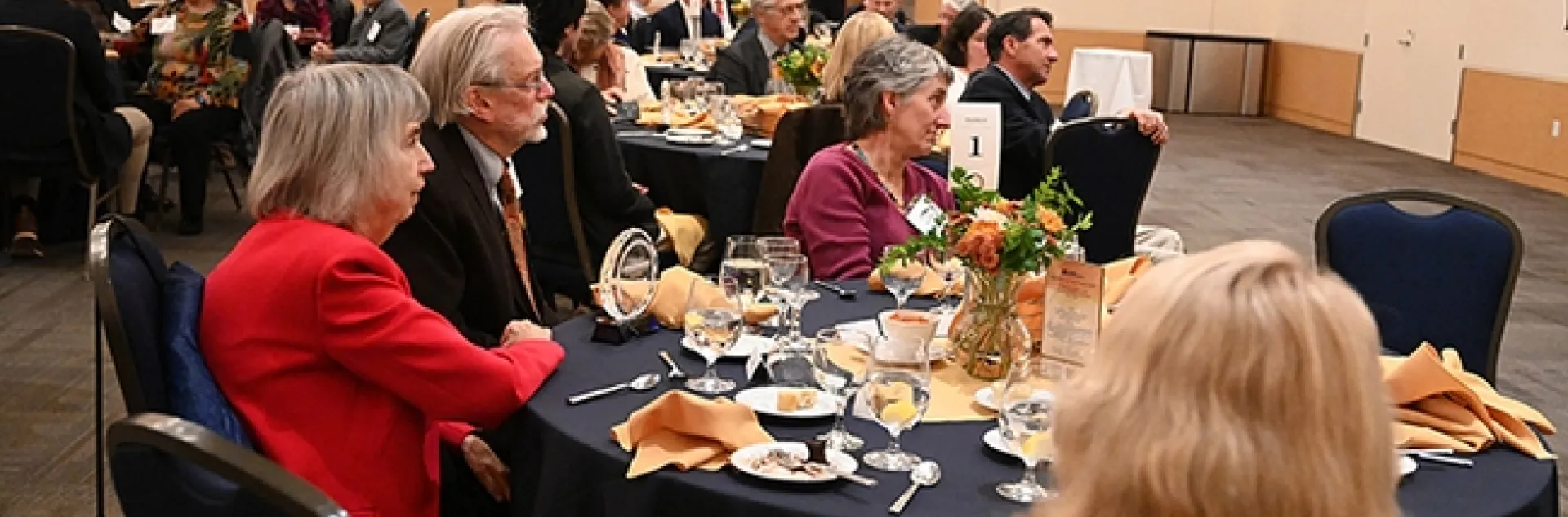 Bill Patterson and his wife, Doris Brown (left), listen to the UC Davis College of Agricultural and Environmental Sciences' Award of Distinction program. At right is Lynn Kimsey, director of the Bohart Museum of Entomology. (Photo by Kathy Keatley Garvey)