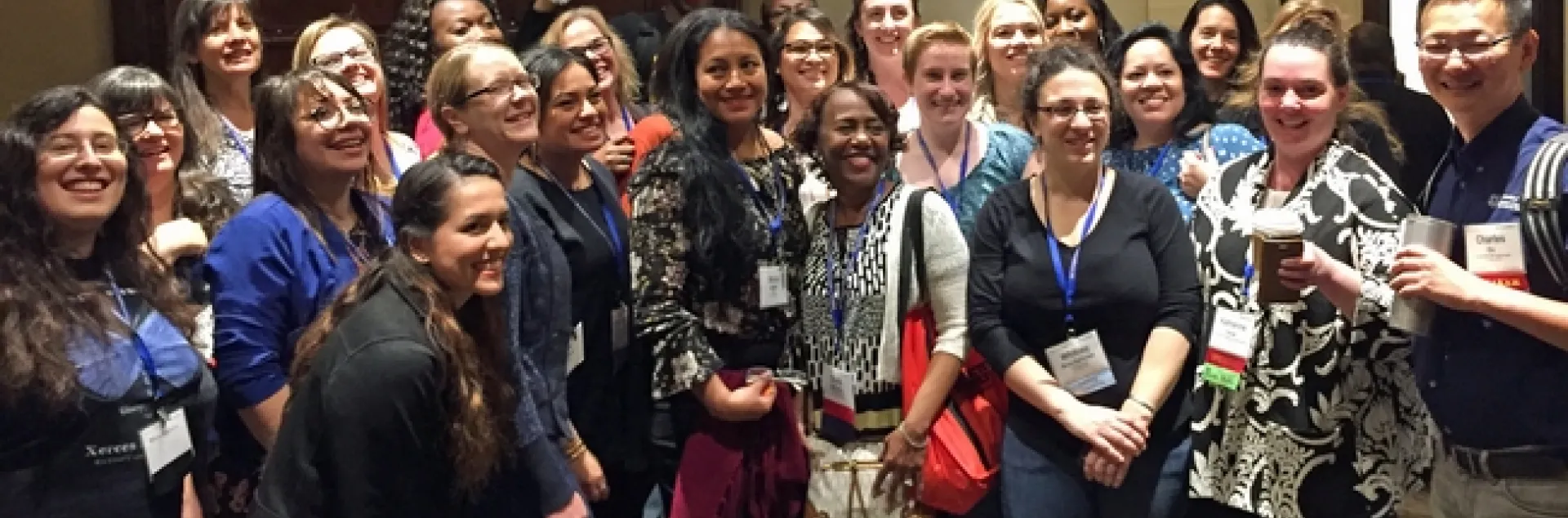 A crowd of smiling men and women.