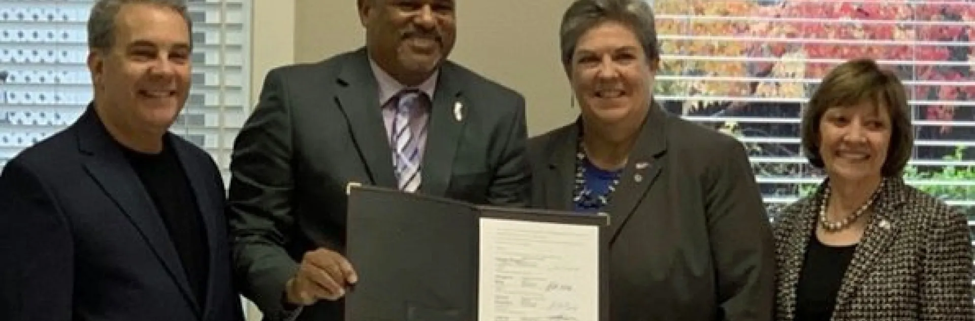 From left, CARCD President Don Butz, USDA NRCS State Conservationist Carlos Suarez, Glenda Humiston and CDFA Secretary Karen Ross sign a memorandum of agreement for the California Conservation Planning Partnership. Photo courtesy of CDFA