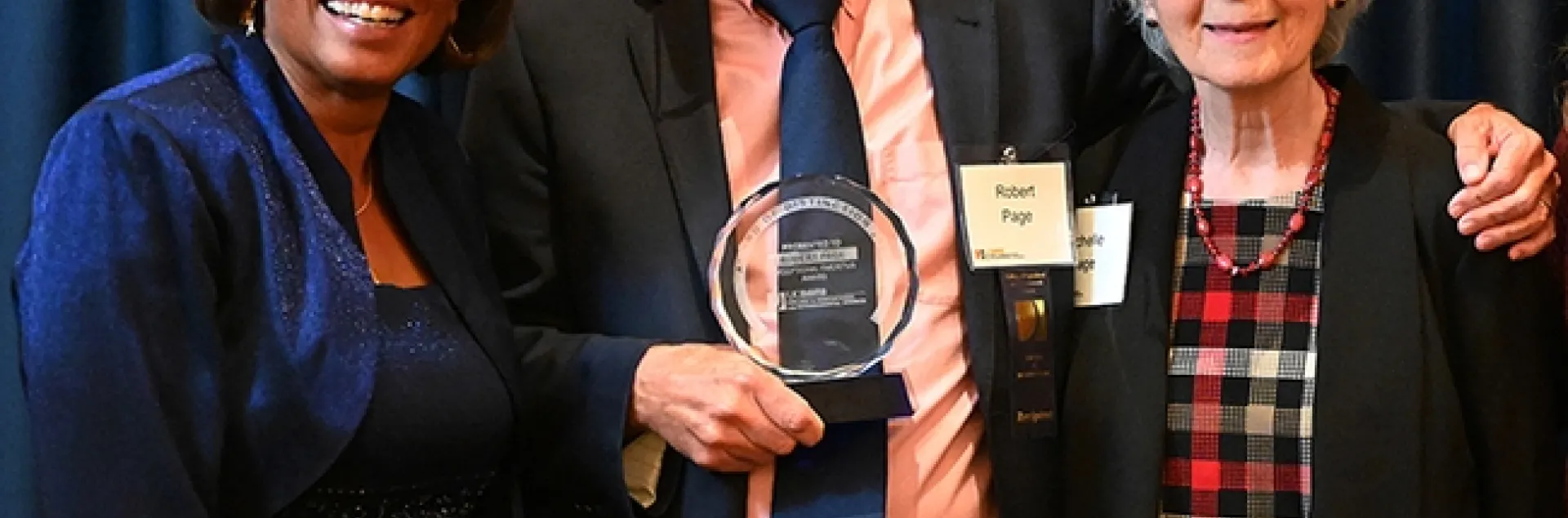 Honey bee geneticist Robert E. Page Jr. poses with his wife Michelle (right) and Helene Dillard, dean of the UC Davis College of Agricultural and Environmental Sciences at a 2022 ceremony honoring him as the recipient of the CA&ES Distinguished Emeritus Award. (Photo by Kathy Keatley Garvey)
