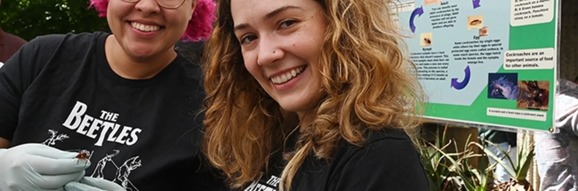 Doctoral candidate Taylor Kelly (right), served as coordinator of the Roach Races. With her is doctoral student Iris Quayle. Both served as announcers and roach handlers. (Photo by Kathy Keatley Garvey)