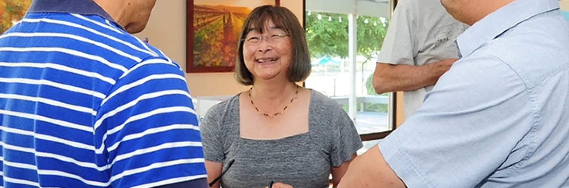 At her retirement party July 22, 2016 in the Stonegate Country Club, Davis, Shirley Gee chats with colleagues Hee Joo Kim (left), former Hammock lab post-doctorate and currently at Bayer US Innovation Center in Mission Bay, San Francisco; and Ki Chang Ahn, former Hammock lab post-doctorate and currently at PTRL West in Richmond, Calif. (Photo by Kathy Keatley Garvey)