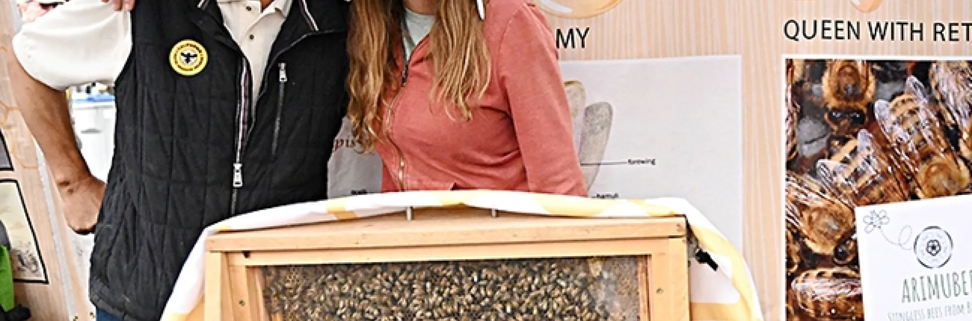 Master Beekeeper Sung Lee of Castro Valley, known worldwide on social media as "Sung Lee The Bee Charmer," displayed his observation hive at the California Honey Festival. With him is fellow CAMBP member Leandra Hale of Lake Tahoe. (Photo by Kathy Keatley Garvey)