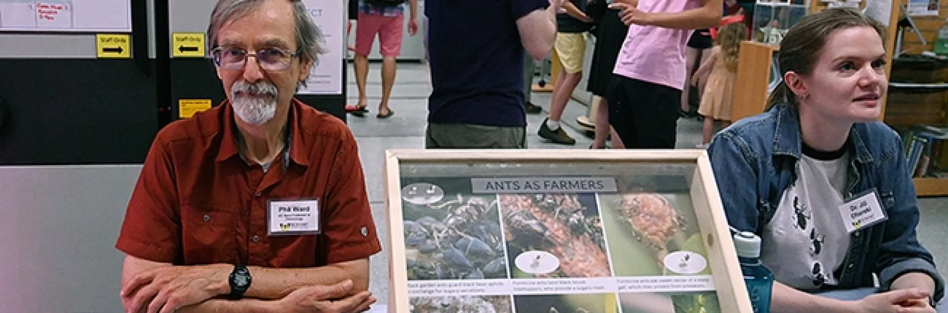 UC Davis professor Phil Ward and lab member Jill Oberski, greet guests at the Bohart Museum open house. In the center is a display on "Ants as Farmers." In back are Bohart collections manager Brennen Dyer (left) conversing with Alex Francis, a freshman at Heritage High School, Brentwood. (Photo by Kathy Keatley Garvey)