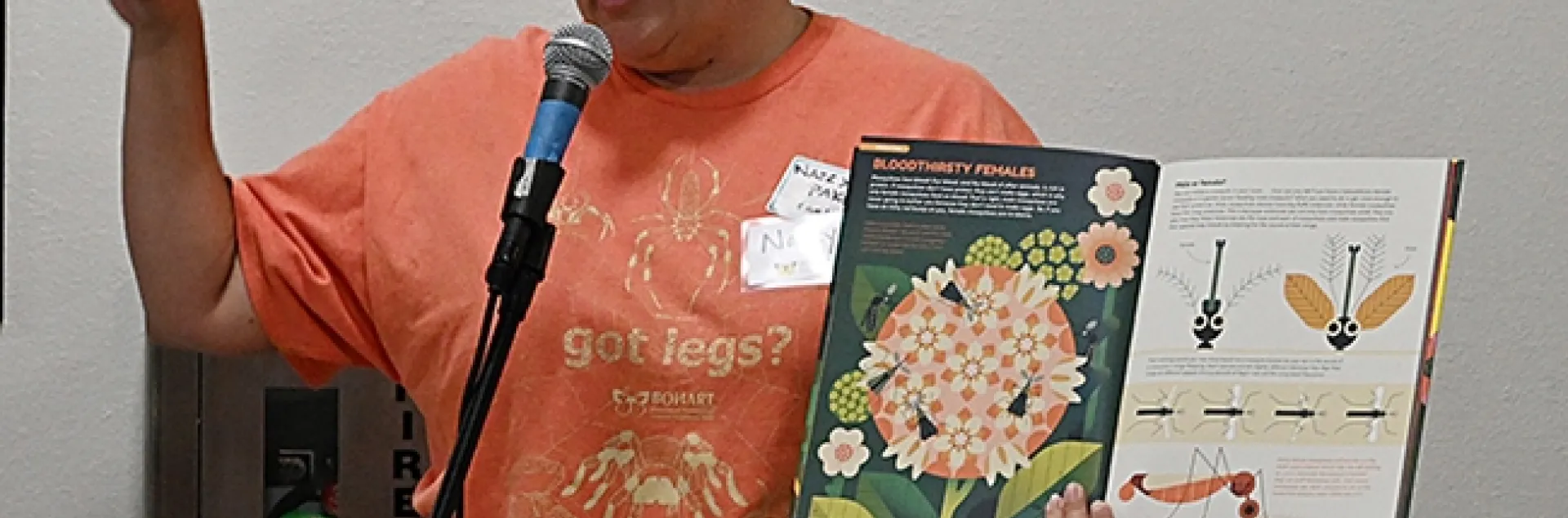 UC Davis alumna Nazzy Pakpour, who holds a doctorate microbiology, virology and parasitology from the University of Pennsylvania, reads from her children's book, "Please Don't Bite Me," at a recent Bohart Museum of Entomology open house. (Photo by Kathy Keatley Garvey)