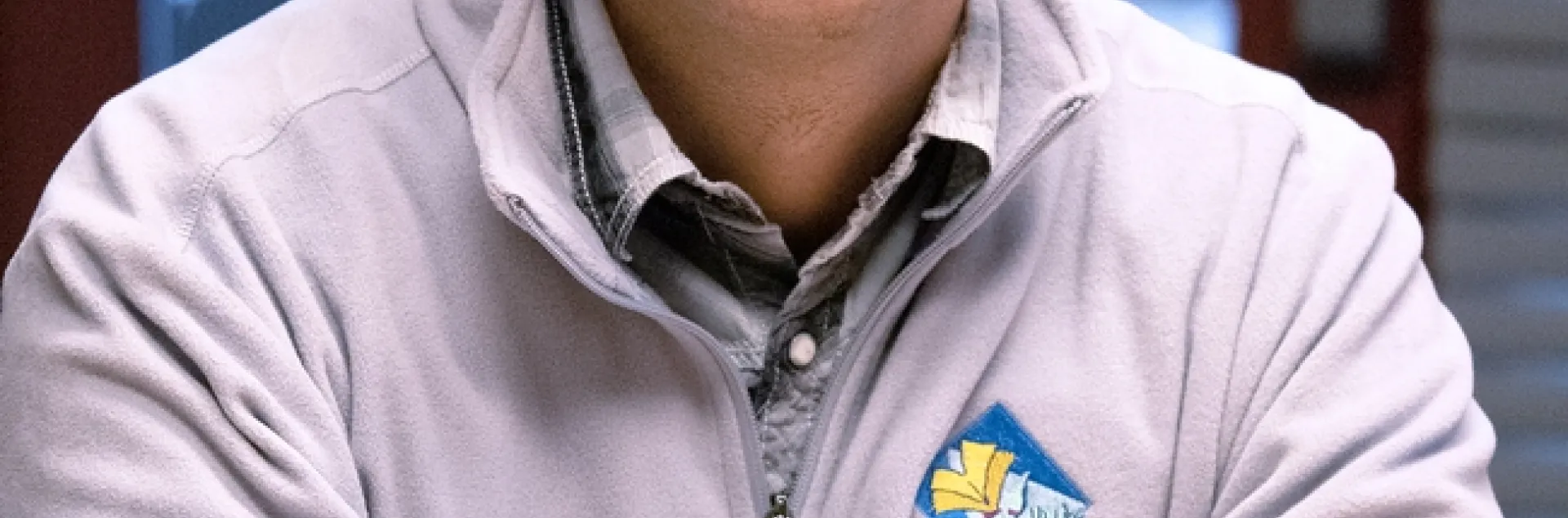 Danny is wearing a jacket sporting the UC Master Gardener logo.