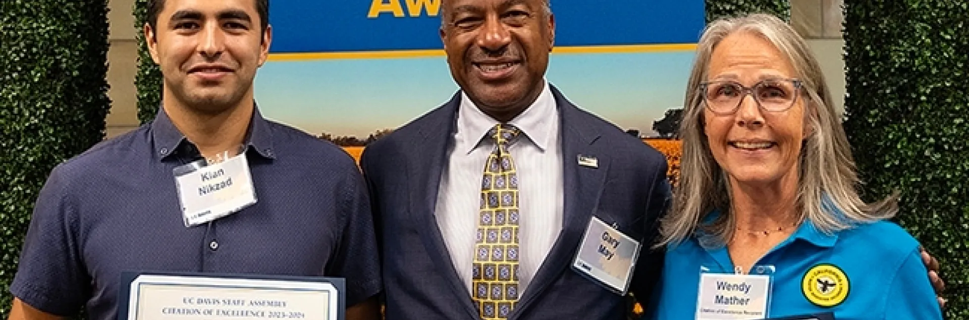 UC Davis Chancellor Gary May congratulates the California Master Beekeeper Program. With him are co-program managers Wendy Mather and Kian Nikzad. (Photo by Kathy Keatley Garvey)