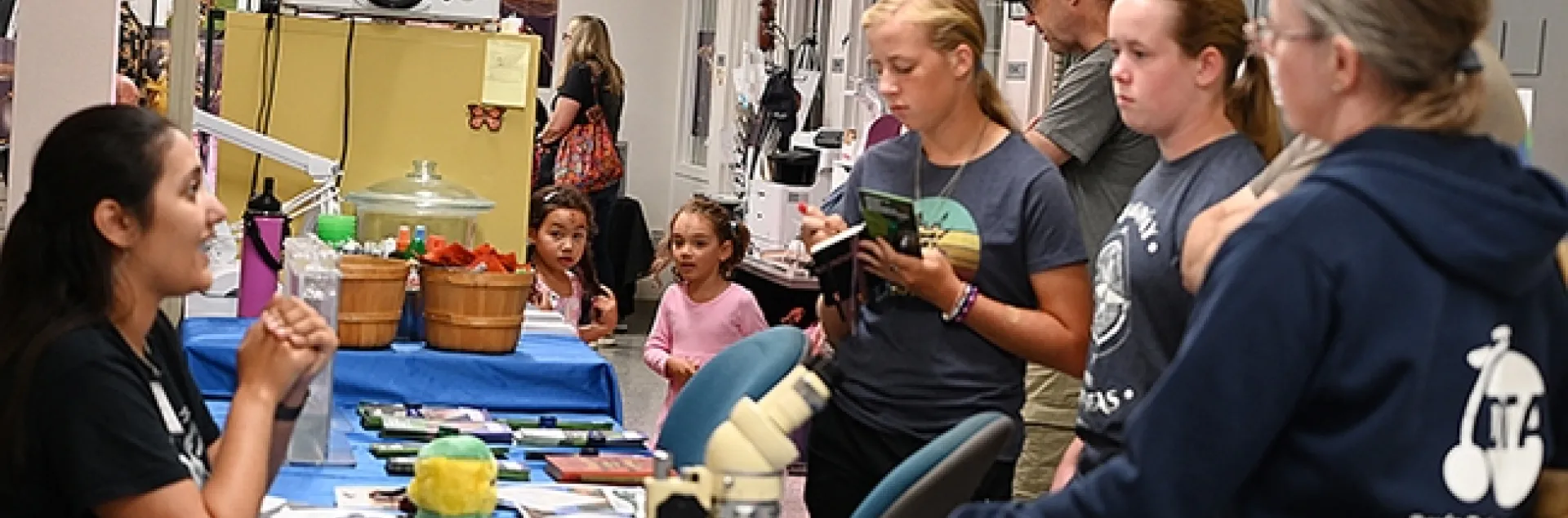 CC Edwards (left), a doctoral student and mosquito research in the lab of UC Davis medical entomologist-geneticist Geoffrey Attardo, answers questions about mosquitoes. (Photo by Kathy Keatley Garvey)